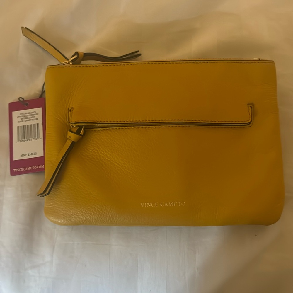 New with tags Vince Camuto bag there is slight discoloration on the back